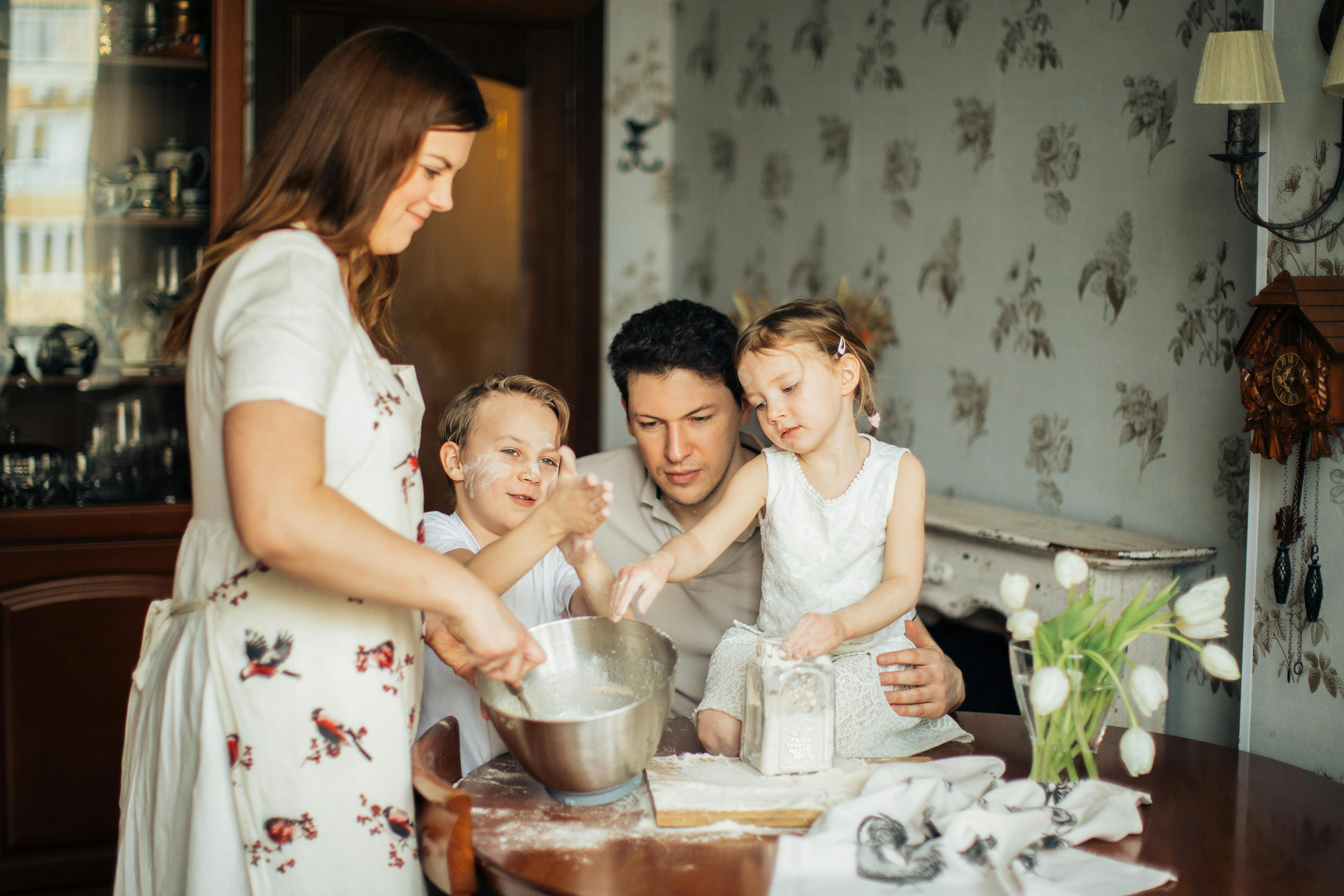 Happy family cooking together in kitchen